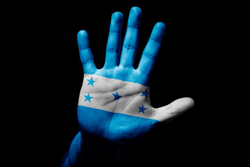 man hand with flag of Honduras in stop sign