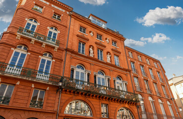 Facades of buildings in trinity square in Toulouse, Occitanie, France