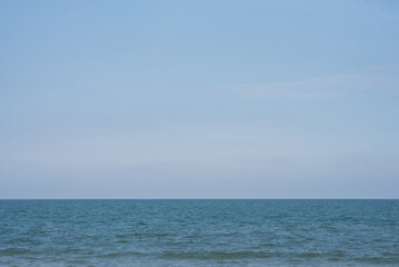 Obraz premium Blue sea and blue sky background.