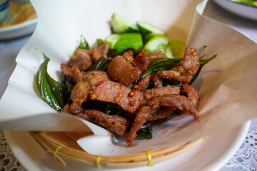 Deep fried sun dried beef with herbs, Top view.