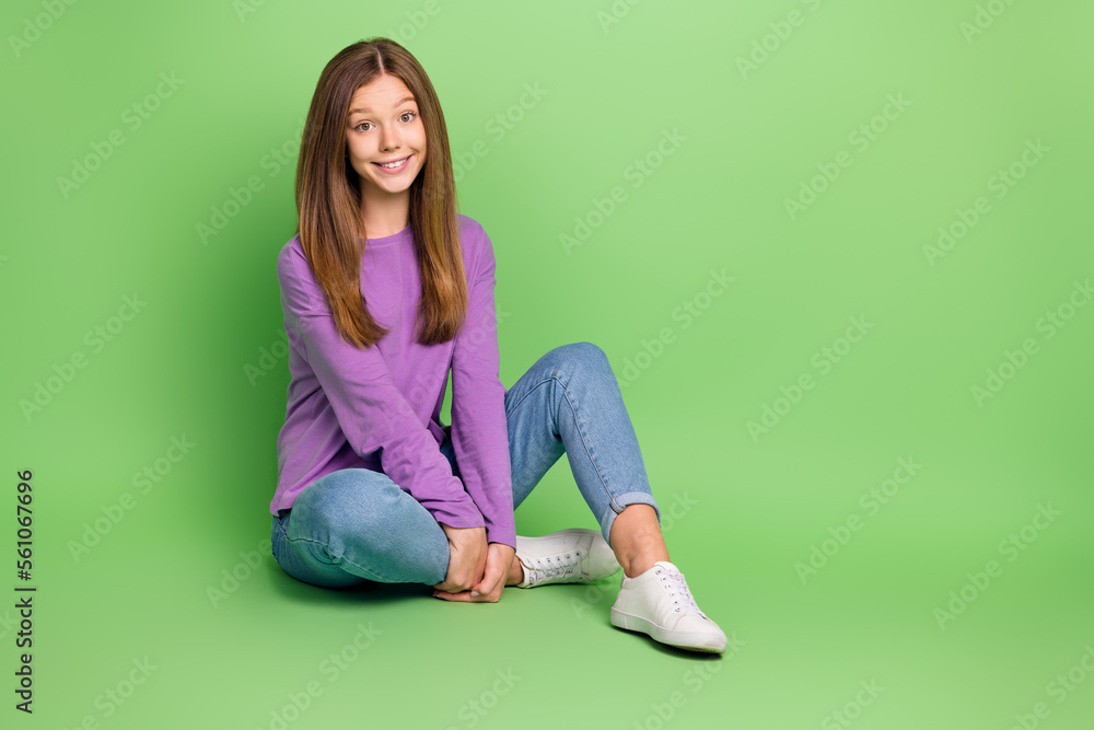 Sticker full length photo of positive nice girl with straight hairdo wear purple pullover jeans sitting isol