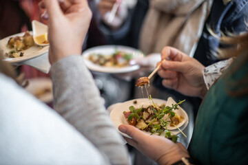 Guests enjoying the menu at a food festival in the Fall