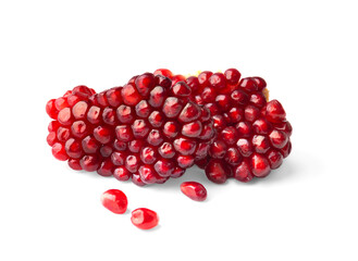 Two pieces of pomegranate and a few scattered seeds on a white background