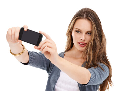 Mobile phone, studio selfie and woman with cellphone memory picture for social media app, online website or social network. Digital tech user, smartphone photo and model girl pose on white background