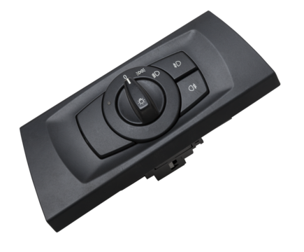 Close-up on the headlight switch control buttons and automatic adjust level dashboard of car in the vehicle repair workshop on white isolated background. Auto service industry