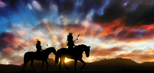 Two members of the Assiniboine tribe on horseback at sunset in the Montana Territory  America. © ginettigino