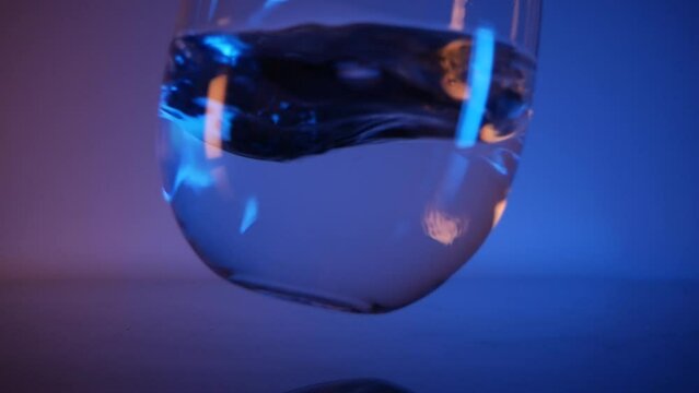 Mineral water in a glass Neon glow