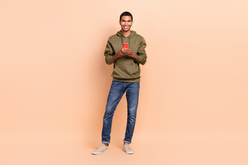 Photo of nice cheerful man blogger use modern telephone sumsung iphone telegram instagrm app...