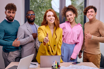 confident smiling businesswoman offering hand for handshake, looking at camera, friendly hr manager team leader welcoming new worker, making agreement or great deal. colleagues team stand in row
