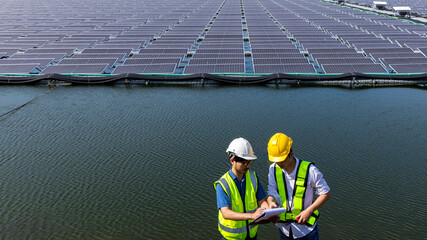 Engineer working setup Floating solar panels or solar cell Platform system on the lake. Engineer or...