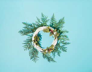 Christmas Wreath Made of Naturalistic Looking Pine Branches with red berries. Frame for Christmas cards and winter design.