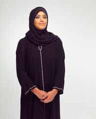 Beauty, muslim and young woman in studio with a traditional, religious and modern dress. Religion, hijab and islam female model in an islamic culture outfit and headscarf isolated by white background