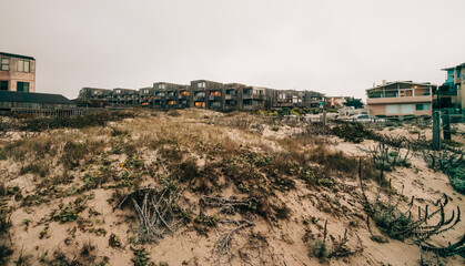 Fototapeta na wymiar Surf Way Condos at Del Monte Beach is a small ocean side community nestled in the sand dunes above Del Monte Beach in Monterey county, CA