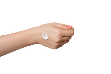 A drop of cream on a female hand, isolate on a white background.