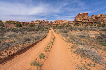 hiking the chesler park loop trail in the needles in canyonlands national park, usa