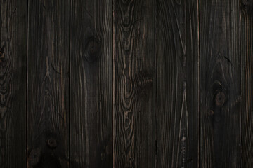 Wooden background made of ebony, persimmon. Dark background with clear wooden structure