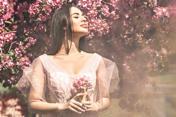 Pink flowers garden girl trees mood happiness, tourism in Asia, blooming traditional seasonal background April.waffle cone with flowers