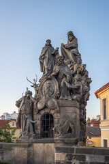 Fototapeta na wymiar Statues of John of Matha, Felix of Valois and Saint Ivan at Charles Bridge - Prague, Czech Republic.