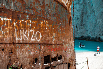 Zakynthos Island, Ionian, Greece - 16 June 2022: famous popular destination for travellers old shipwreck in Navagio bay