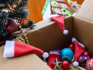 Carton box with taken down Christmas tree decorations 