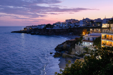 Nerja coastline at dusk overlooking el salon beach