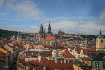 Aerial view of Church of Our Lady before Tyn and Old Town Hall tower with Prague Castle on background - Prague, Czech Republic