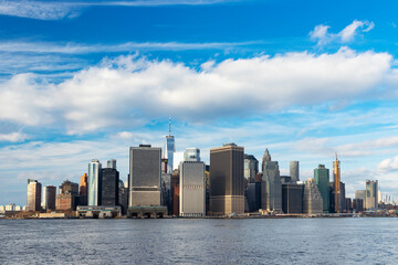 Fototapeta premium The skyline of lower Manhattan, viewed from a ferry.