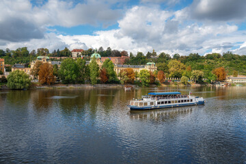 Fototapeta na wymiar Tourist Boat on Vltava River - Prague, Czech Republic