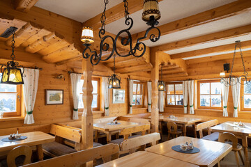 Beautiful design of the mountain restaurant, decorated in the national Austrian style