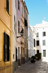 Traditional mediterranean architecture with painted buildings on a cobblestone street