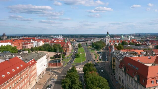 Aerial panoramic cityscape of Szczecin, Poland. Flying along the Aleja Kwiatowa street and Plac Solidarności, where all of city main landmarks can be found.
