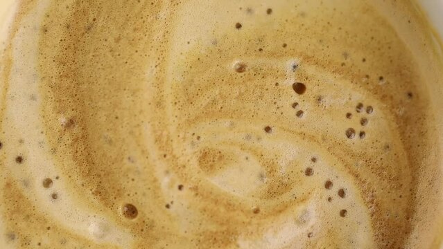 coffee with foam and bubbles close up macro