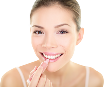 Lipstick makeup woman putting lip balm care. Beauty Asian girl applying color moisturizer on lips getting ready and looking at herself in the mirror smiling happy. Multi-ethnic Asian Caucasian model.