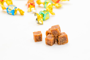 Casual snack beef cubes on a solid color background