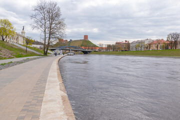 Fototapeta na wymiar Vilnius, Lithuania . Panoramic view of the riverside and Gediminas Tower visible in distance.