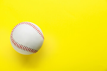 Baseball ball on yellow background, top view with space for text. Sports game
