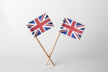 Small paper flags of United Kingdom on light background