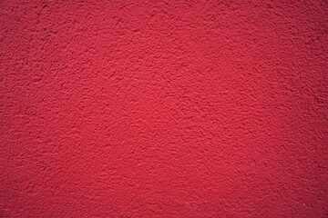 Rote verputzte Betonwand mit Muster 