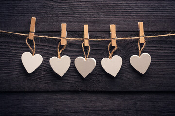 white heart on the twine with clothespins