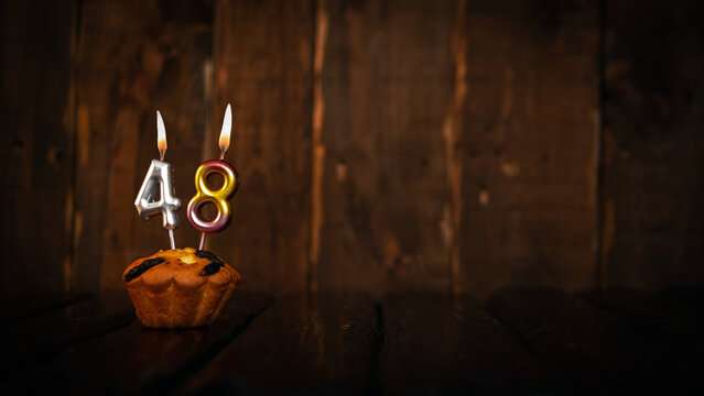 Festive background happy birthday copy space. Anniversary background with cypher and muffin. Beautiful brown from vintage boards background before a birthday with a number  48