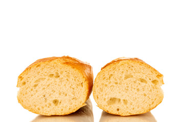 Two halves of fresh fragrant baguette, macro, isolated on white background.