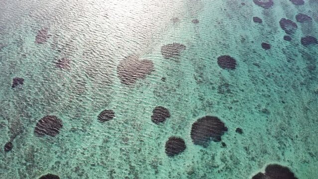 4K Drone footage flying over tranquose Le Morne coral reef bay, Mauritius. Exotic tropical nature, environment 4K concept.