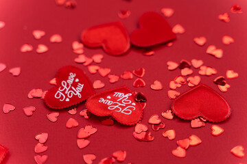 Many hearts with inscriptions I love you on a red background. Valentine's day concept, February 14