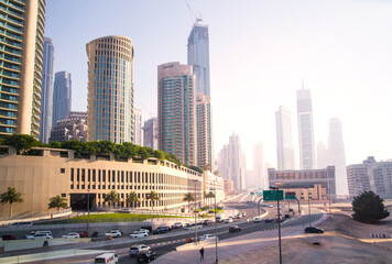 Dubai, UAE 2022. City road view with cars at sunset