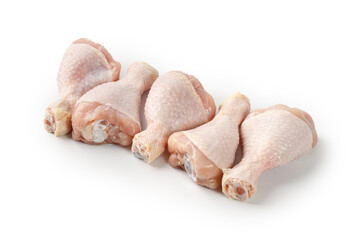 Fresh uncooked raw chicken legs drumsticks isolated on a white background with clipping path, cut...