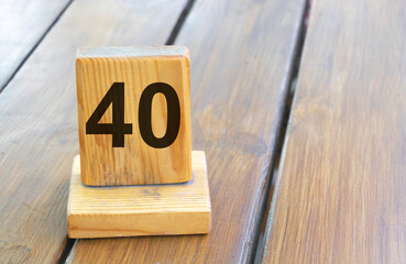 Wooden priority number 40 on a plank tab