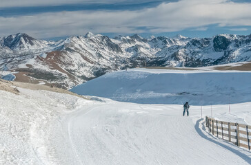 Snow skiing the last run of the day