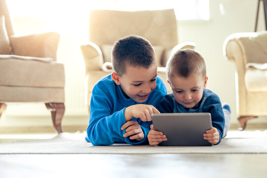 Happy children playing video games
