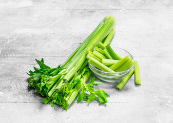 Pieces of celery in a glass bowl.