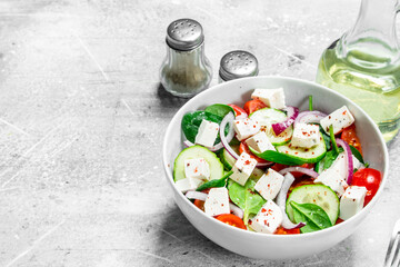 Vegetable salad. Salad with vegetables, cheese and olive oil.